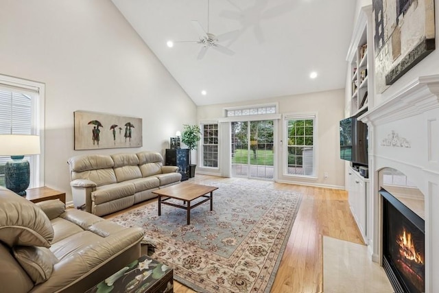15 Louden Loop, Mount Sinai, NY 11766 - living room featuring high vaulted ceiling, a premium fireplace, a ceiling fan, light wood-style flooring, and recessed lighting