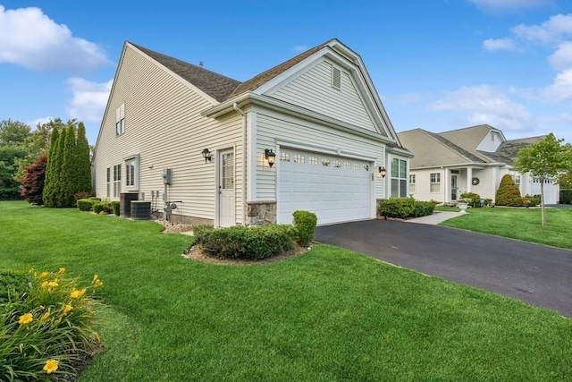 15 Louden Loop, Mount Sinai, NY 11766 - view of front of property with asphalt driveway, a front lawn, and a garage