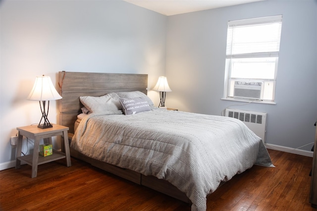 95 N Broadway Unit D2-5, White Plains, NY 10603 - bedroom with radiator heating unit, wood finished floors, and cooling unit