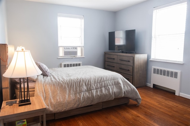 95 N Broadway Unit D2-5, White Plains, NY 10603 - bedroom featuring radiator, wood finished floors, and cooling unit
