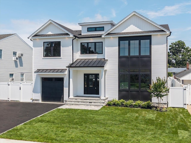 724 Pleasant Ave, Westbury, NY 11590 - view of front of property with a gate, a standing seam roof, a shingled roof, driveway, and a garage
