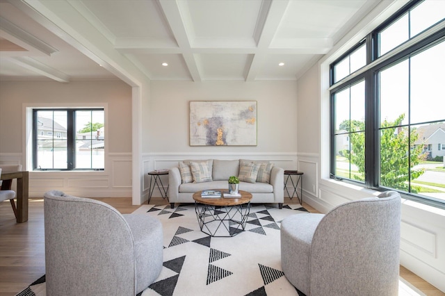 724 Pleasant Ave, Westbury, NY 11590 - living room featuring plenty of natural light, beamed ceiling, recessed lighting, coffered ceiling, and light wood-style flooring