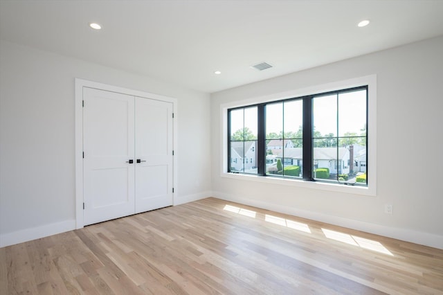724 Pleasant Ave, Westbury, NY 11590 - unfurnished bedroom featuring light wood-style floors, recessed lighting, and a closet