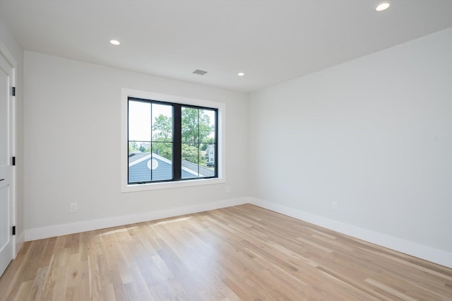 724 Pleasant Ave, Westbury, NY 11590 - unfurnished room featuring light wood finished floors and recessed lighting
