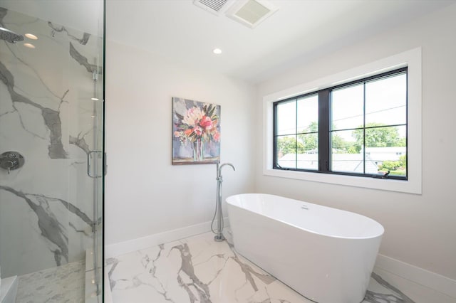 724 Pleasant Ave, Westbury, NY 11590 - full bath with marble look tiles, a marble finish shower, a freestanding bath, and recessed lighting