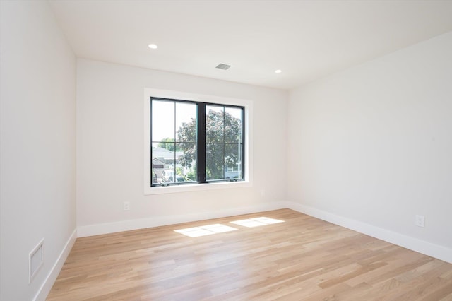724 Pleasant Ave, Westbury, NY 11590 - empty room with light wood-style flooring and recessed lighting