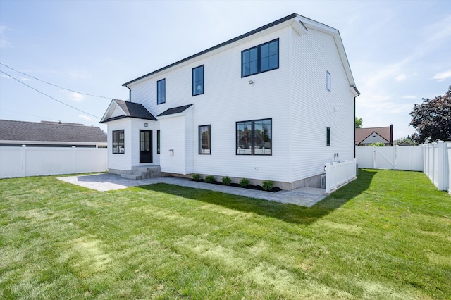 724 Pleasant Ave, Westbury, NY 11590 - rear view of property with a fenced backyard, a patio area, and entry steps