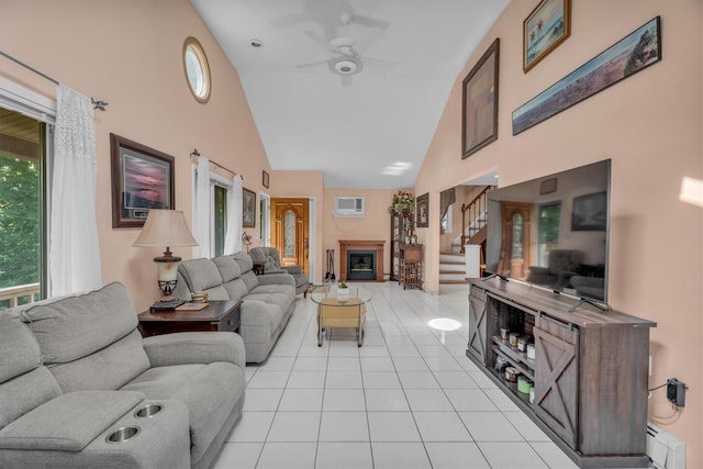 41 Tyler Ave, Sound Beach, NY 11789 - living area featuring high vaulted ceiling, light tile patterned flooring, a ceiling fan, stairway, and a baseboard radiator