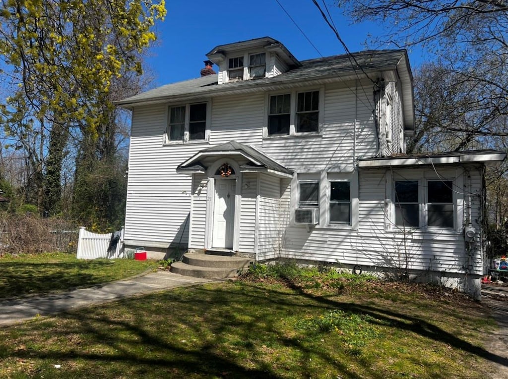21 Old Portion Rd, Lake Ronkonkoma, NY 11779 - american foursquare style home featuring a front lawn and entry steps