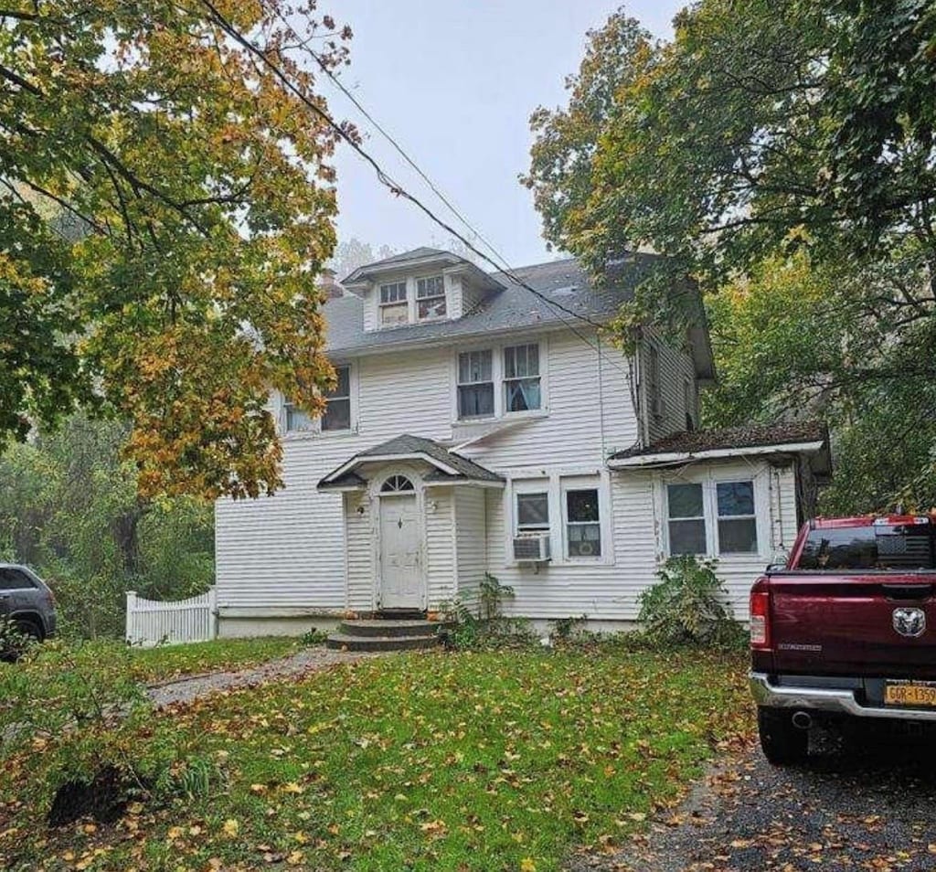 21 Old Portion Rd, Lake Ronkonkoma, NY 11779 - american foursquare style home featuring cooling unit and a front lawn