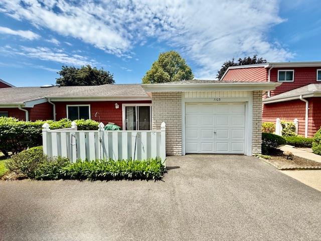 1104 Drew Dr, Saint James, NY 11780 - view of front of property with an attached garage and driveway