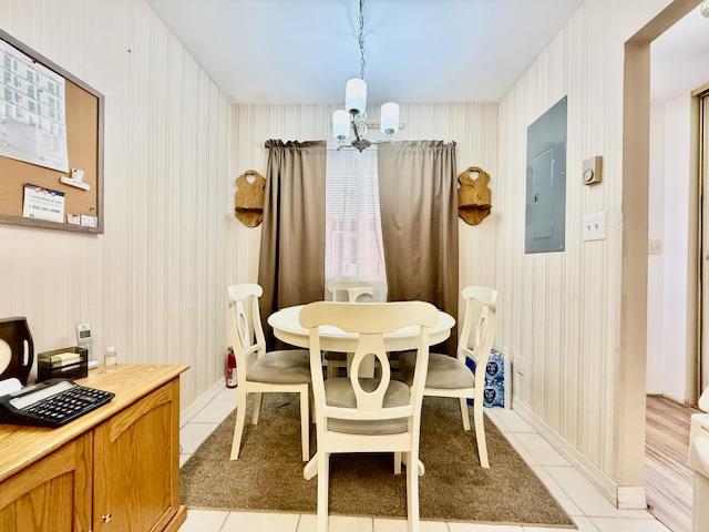1104 Drew Dr, Saint James, NY 11780 - dining area with electric panel, a chandelier, light tile patterned flooring, and an office area