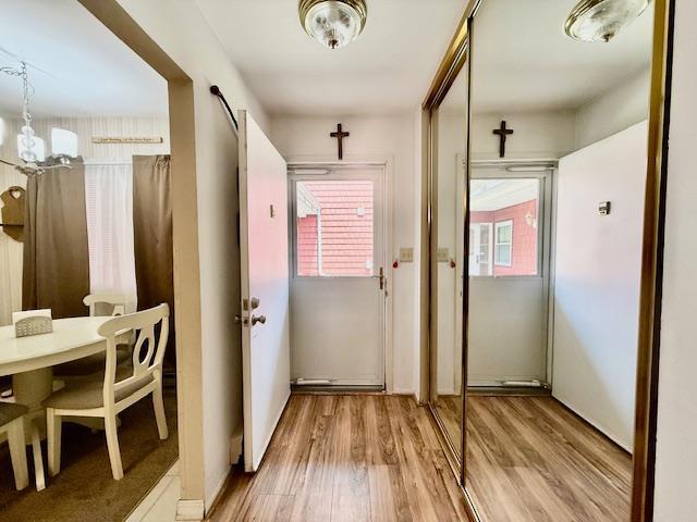 1104 Drew Dr, Saint James, NY 11780 - doorway with wood finished floors