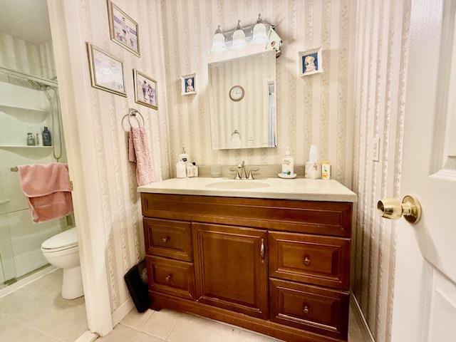 1104 Drew Dr, Saint James, NY 11780 - full bath with wallpapered walls, tile patterned flooring, vanity, and a shower
