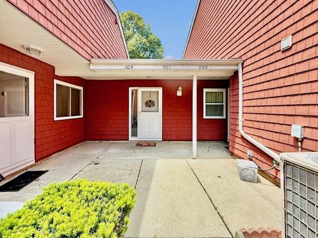 1104 Drew Dr, Saint James, NY 11780 - entrance to property with a patio