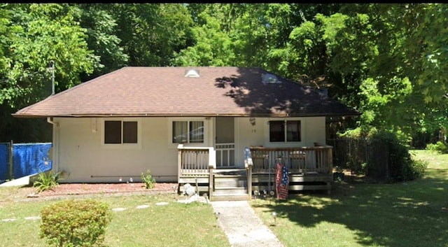 19 Old Portion Rd, Lake Ronkonkoma, NY 11779 - bungalow-style house with a shingled roof, a wooden deck, and stucco siding