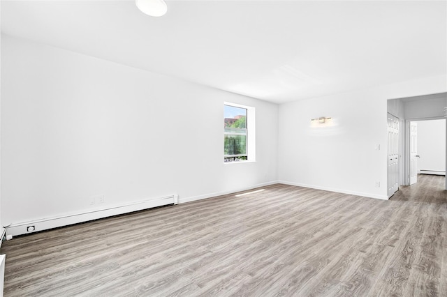 800 Brook Ave Unit 13B, Bronx, NY 10451 - unfurnished room with wood finished floors, a baseboard heating unit, and baseboard heating