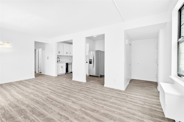 800 Brook Ave Unit 13B, Bronx, NY 10451 - unfurnished living room featuring light wood-style flooring and a sink