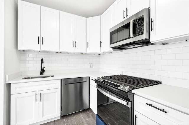 800 Brook Ave Unit 13B, Bronx, NY 10451 - kitchen featuring appliances with stainless steel finishes, light countertops, and white cabinetry