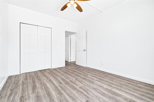 800 Brook Ave Unit 13B, Bronx, NY 10451 - unfurnished bedroom with wood finished floors, a closet, and a ceiling fan