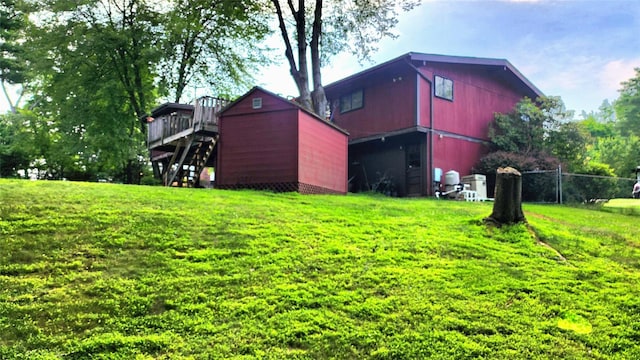 27 Maiden Ln, New City, NY 10956 - view of yard with stairway, a storage unit, and a wooden deck