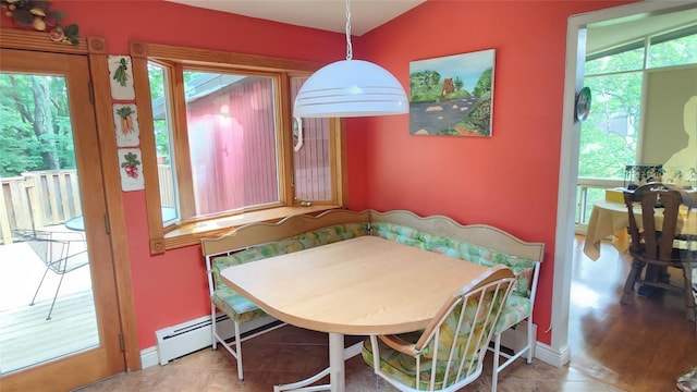 27 Maiden Ln, New City, NY 10956 - dining space featuring healthy amount of natural light, baseboard heating, and tile patterned flooring