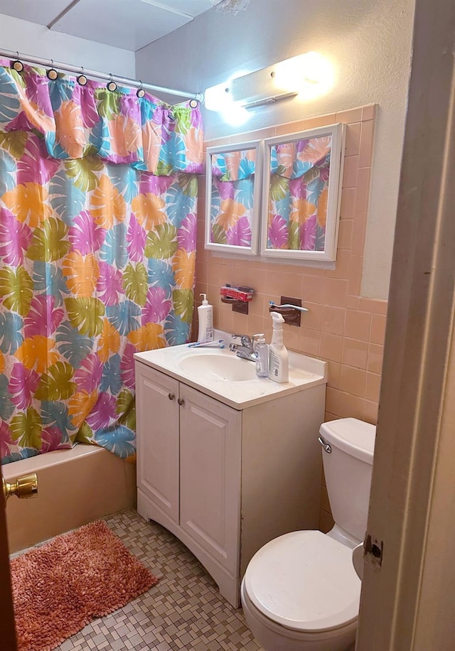 804 E 221st St, Bronx, NY 10467 - full bathroom with vanity, shower / bath combination with curtain, tile patterned floors, and tile walls
