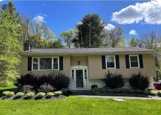4 St Michaels Ln, Walden, NY 12586 - view of front of house featuring a chimney and a front yard