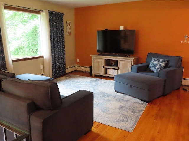 4 St Michaels Ln, Walden, NY 12586 - living room featuring a baseboard heating unit and wood finished floors