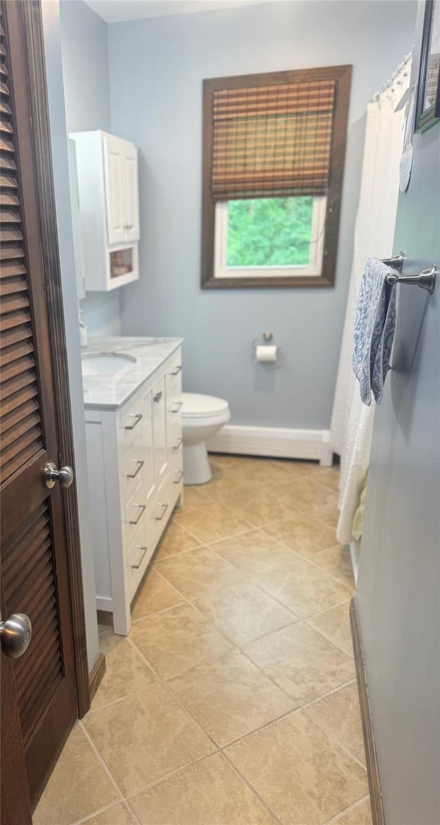 4 St Michaels Ln, Walden, NY 12586 - bathroom featuring baseboard heating, vanity, and tile patterned flooring