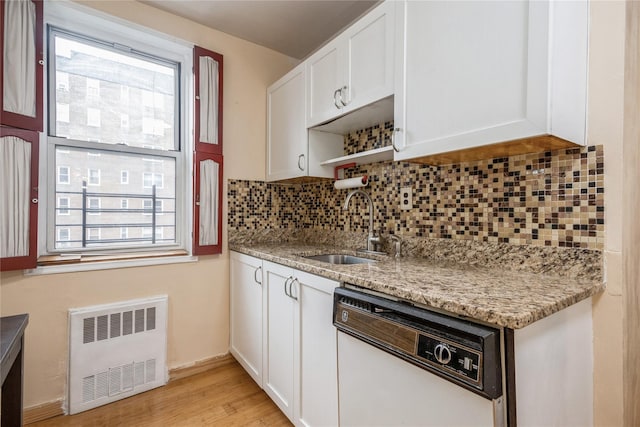 4 Sadore Ln Unit 3E, Yonkers, NY 10710 - kitchen featuring white dishwasher, radiator heating unit, backsplash, and plenty of natural light