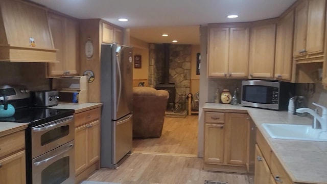 77 Krum, Hurleyville, NY 12747 - kitchen with stainless steel appliances, light countertops, light wood-style floors, and recessed lighting