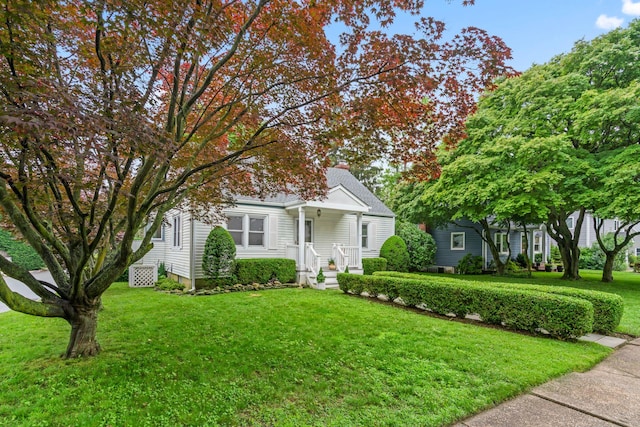 42 Valley Ave, Locust Valley, NY 11560 - view of front facade with a front lawn