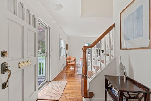 42 Valley Ave, Locust Valley, NY 11560 - foyer featuring light wood-style floors, stairway, and ornamental molding