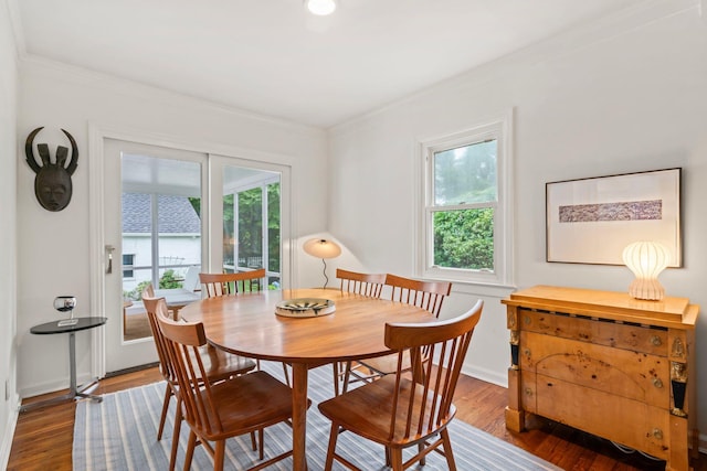 42 Valley Ave, Locust Valley, NY 11560 - dining area featuring healthy amount of natural light, wood finished floors, and crown molding