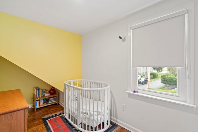 42 Valley Ave, Locust Valley, NY 11560 - bedroom with dark wood finished floors and a nursery area
