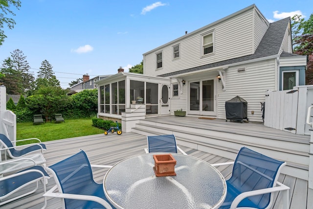 42 Valley Ave, Locust Valley, NY 11560 - back of house with a sunroom, a wooden deck, outdoor dining space, and a shingled roof
