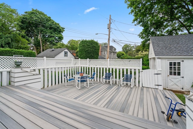 42 Valley Ave, Locust Valley, NY 11560 - deck with outdoor dining area and a shed