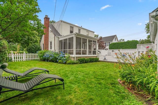 42 Valley Ave, Locust Valley, NY 11560 - back of house featuring a sunroom and a chimney