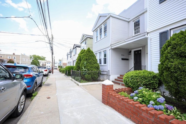 10416 Rosita Rd, Ozone Park, NY 11417 - view of road featuring street lights, sidewalks, and a residential view