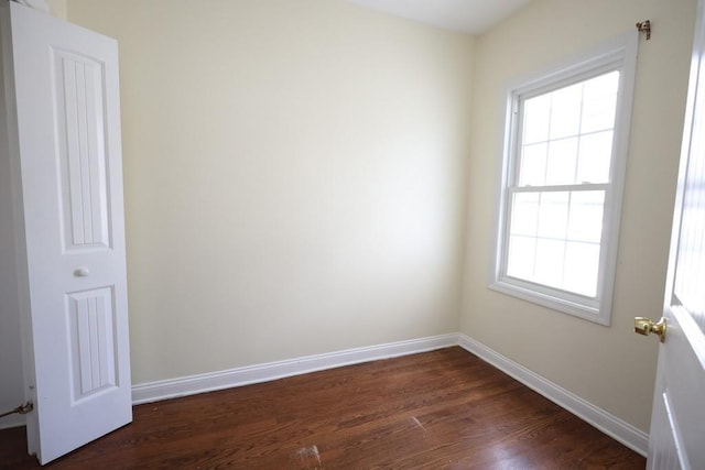 10416 Rosita Rd, Ozone Park, NY 11417 - spare room featuring dark wood finished floors and plenty of natural light