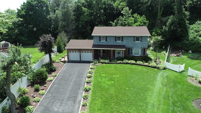 3 New Jersey Ct, Dix Hills, NY 11746 - view of front of house featuring asphalt driveway, an attached garage, brick siding, and roof with shingles