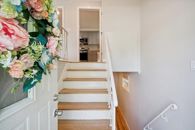 1126 Park Blvd, Massapequa Park, NY 11762 - stairway with wood finished floors