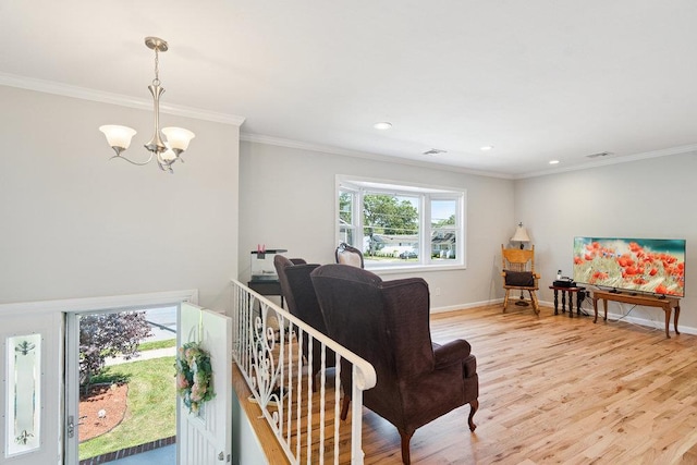 1126 Park Blvd, Massapequa Park, NY 11762 - living area with a chandelier, light wood finished floors, ornamental molding, and recessed lighting