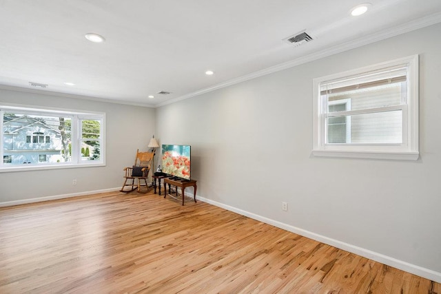 1126 Park Blvd, Massapequa Park, NY 11762 - empty room featuring crown molding, light wood-style floors, and recessed lighting