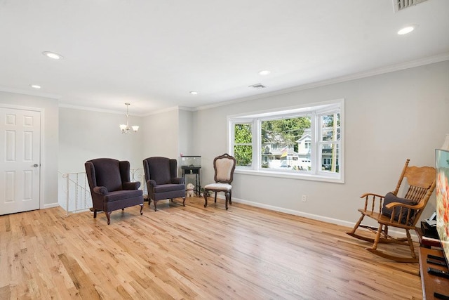 1126 Park Blvd, Massapequa Park, NY 11762 - sitting room featuring light wood-style flooring, a chandelier, crown molding, and recessed lighting
