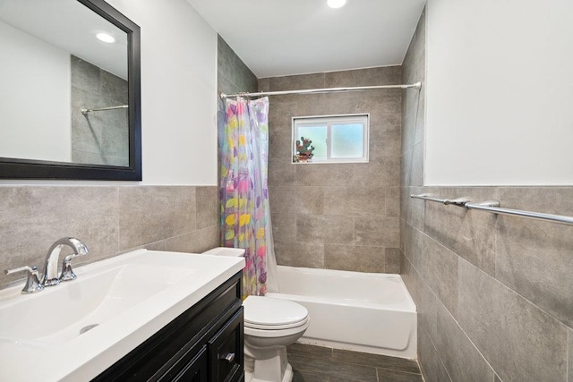 1126 Park Blvd, Massapequa Park, NY 11762 - bathroom featuring tile walls, vanity, shower / tub combo, and wood finished floors