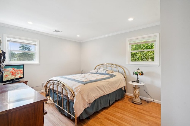 1126 Park Blvd, Massapequa Park, NY 11762 - bedroom featuring multiple windows, light wood-style floors, recessed lighting, and crown molding