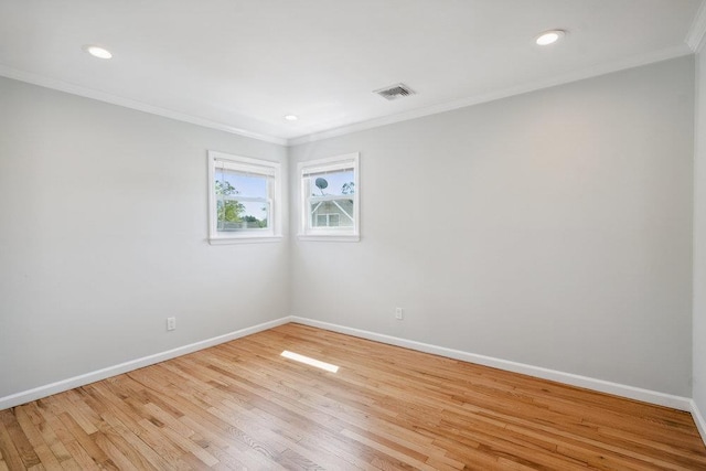 1126 Park Blvd, Massapequa Park, NY 11762 - spare room featuring crown molding, wood finished floors, and recessed lighting