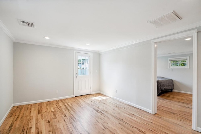 1126 Park Blvd, Massapequa Park, NY 11762 - empty room with crown molding, light wood-type flooring, and recessed lighting